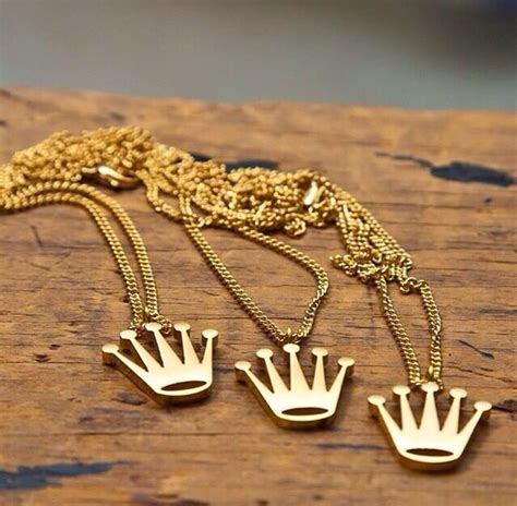 gold rolex earrings|Rolex chain necklace.